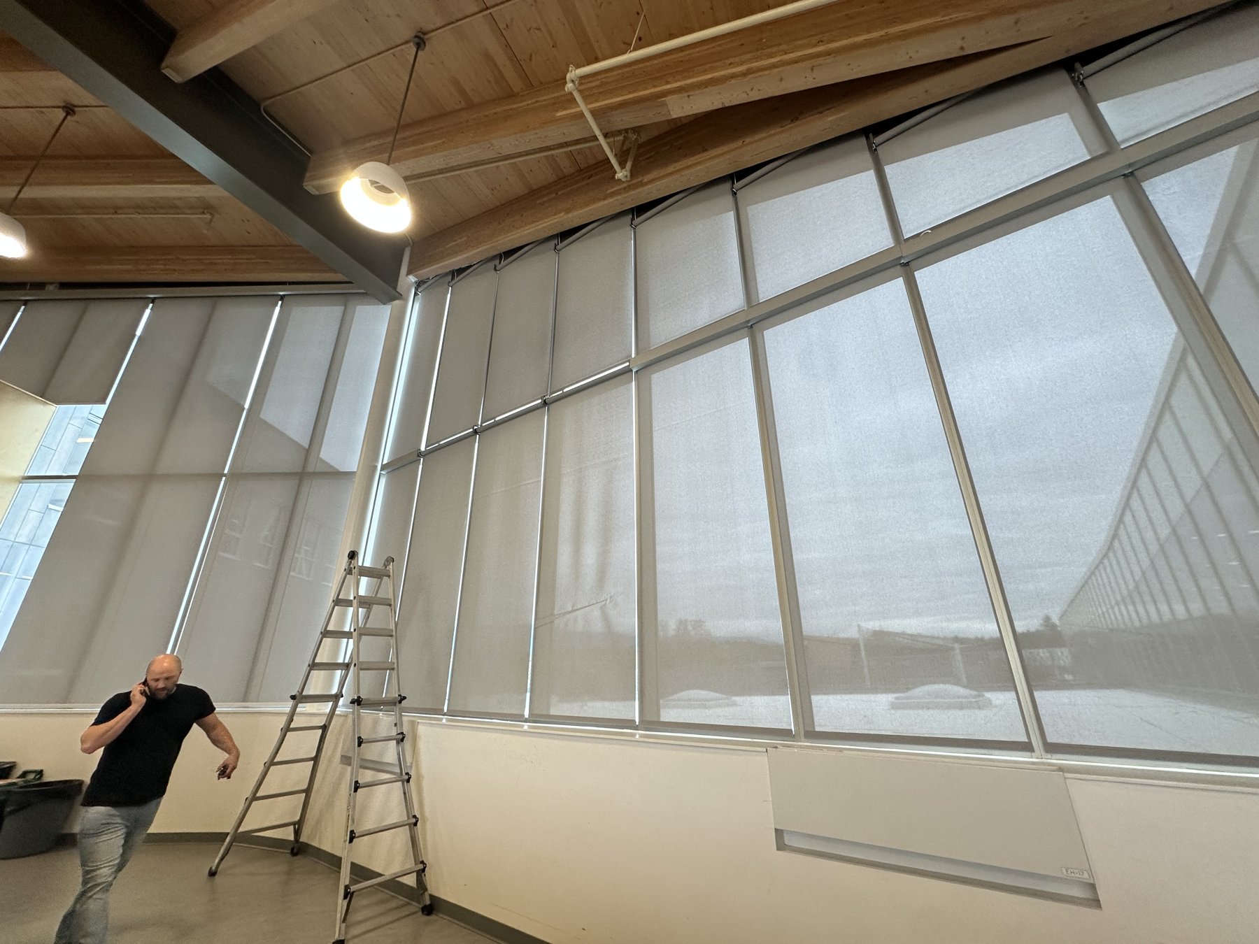 Commercial installation on a curved glass wall