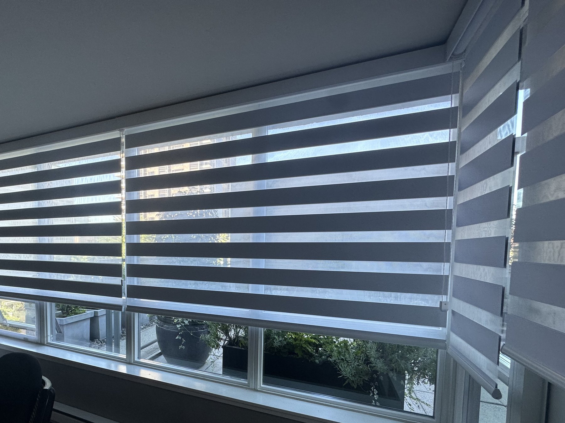 Zebra shades in a condo dining nook